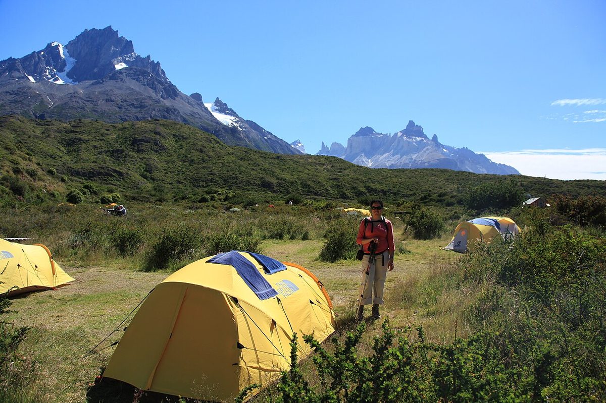 Tents at a campsite below the mountains in Torres del Paine, where bookings are mandatory