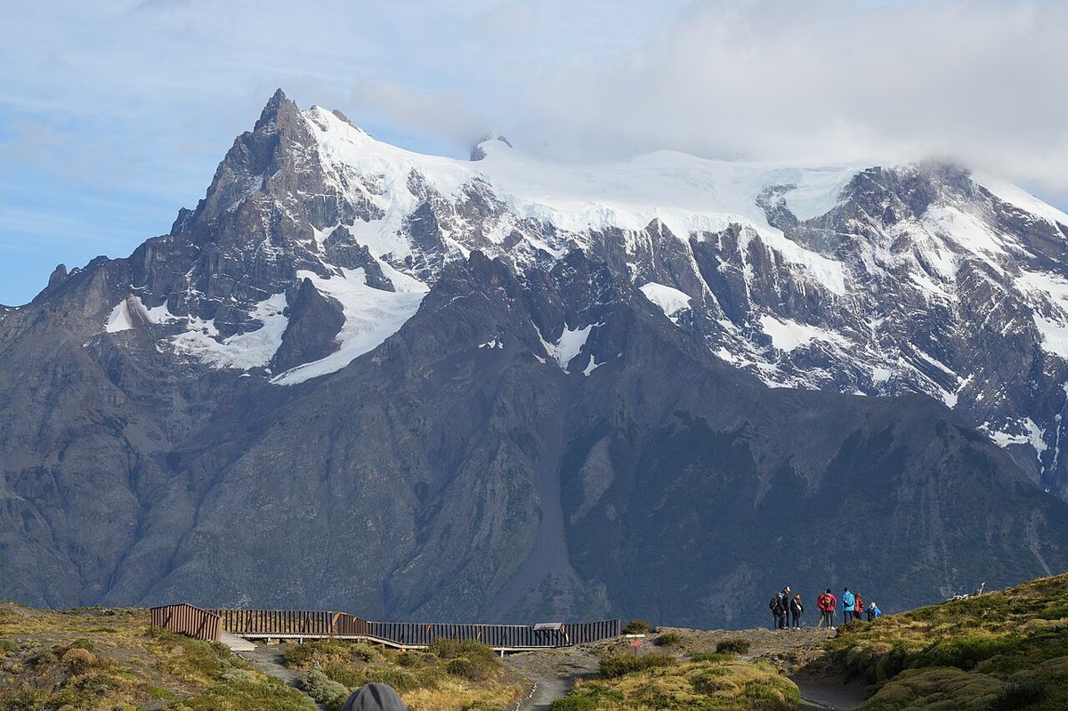 A hiker on John Gardner Pass above the Grey Glacier, the high point of the O Circuit Patagonia loop in Torres del Paine