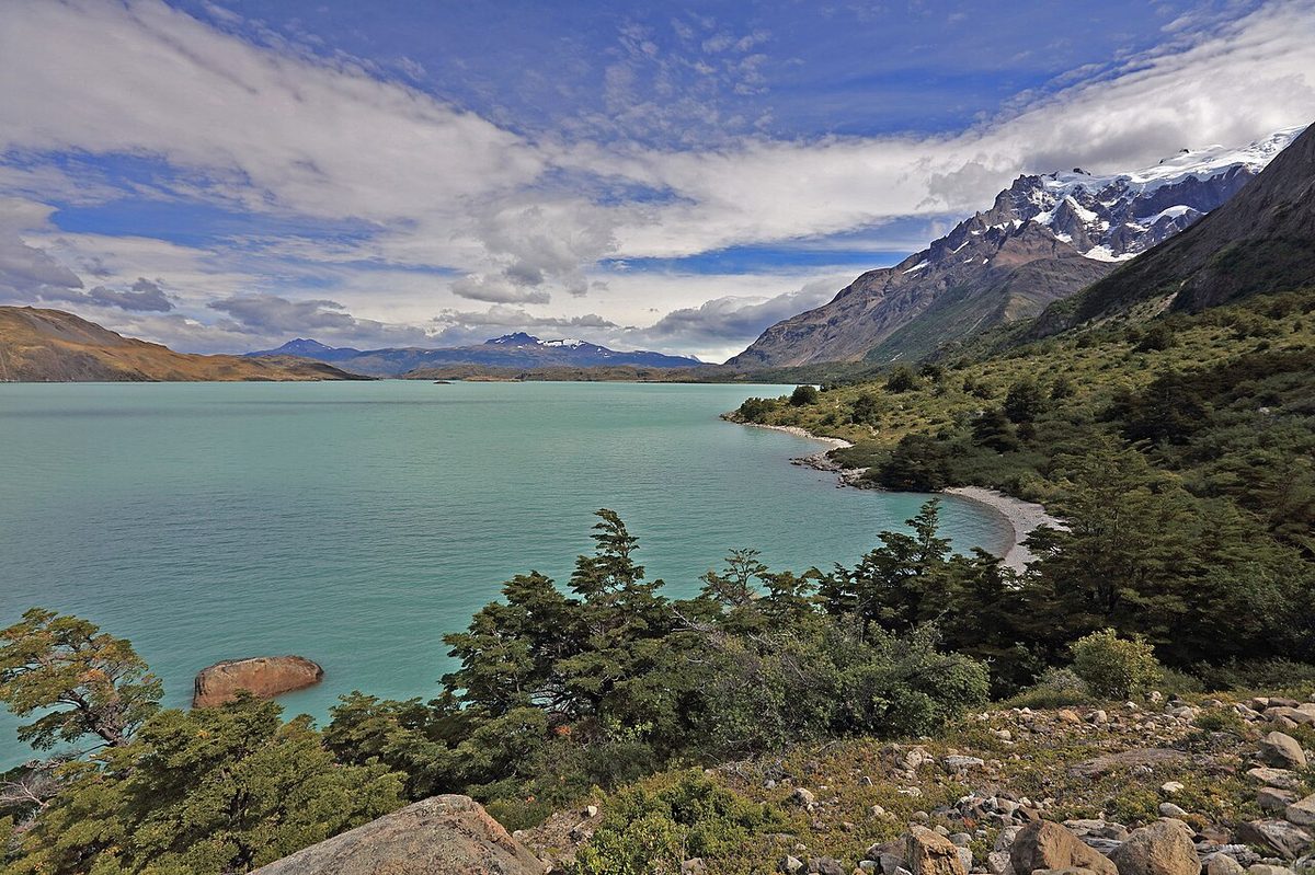 Lago Nordenskjold under cloud in Torres del Paine, on the exposed traverse where afternoon gusts hit hardest
