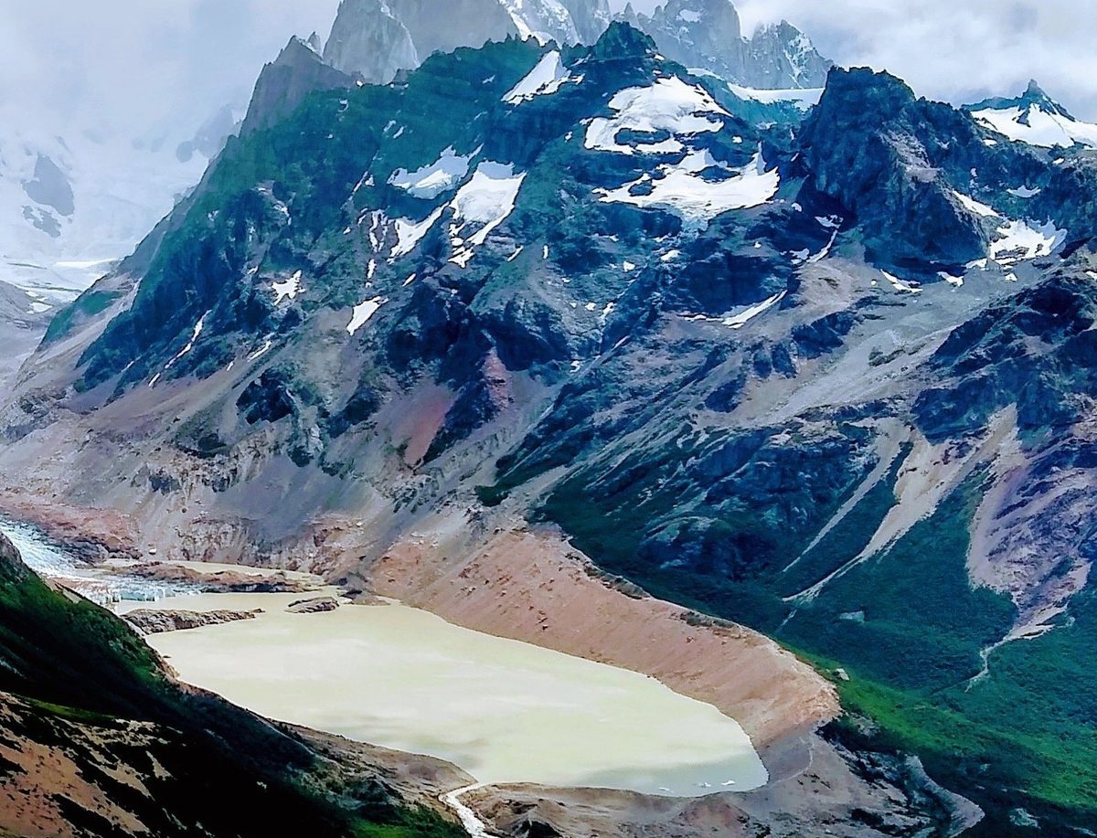 Cerro Torre rising above Laguna Torre on a clear day near El Chalten