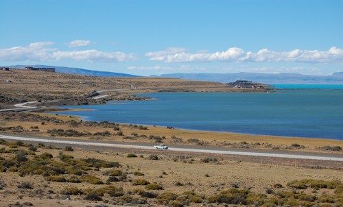 Lago Argentino from the edge of El Calafate, with the road and steppe running down to the turquoise water