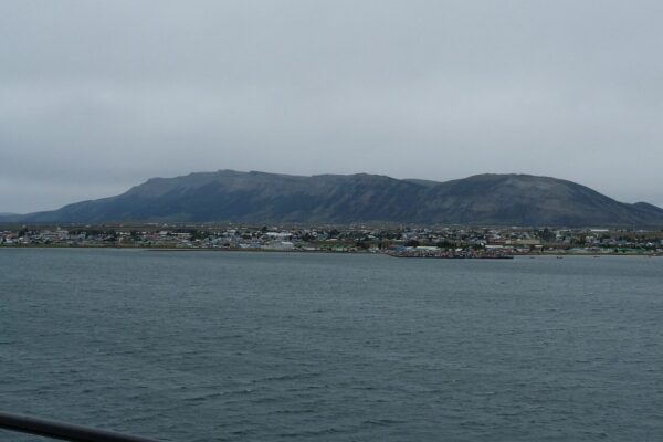 Puerto Natales on the shore of the Última Esperanza Sound with the mountains of the far shore behind the town