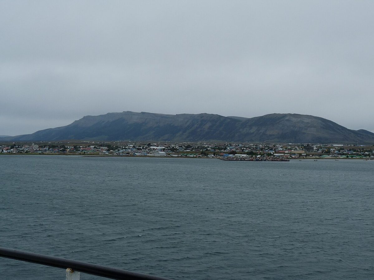 Puerto Natales on the shore of the Última Esperanza Sound with the mountains of the far shore behind the town